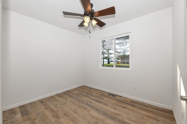 unfurnished room with wood-type flooring and ceiling fan