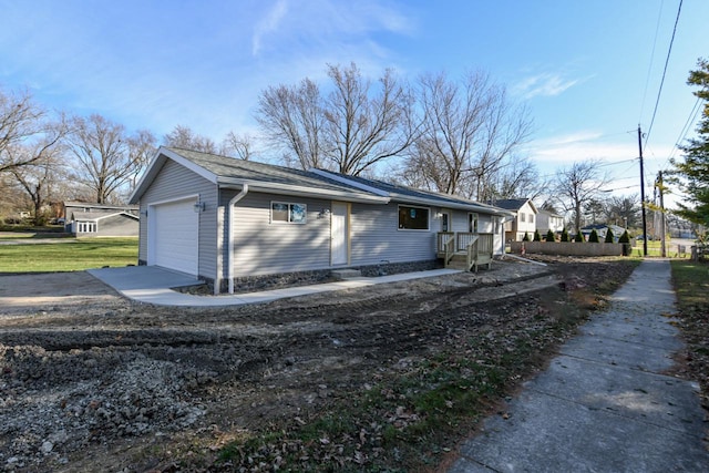 view of side of property with a garage