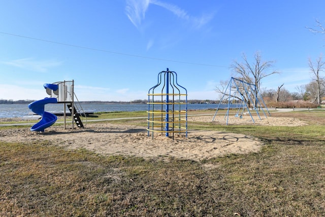 view of playground with a water view