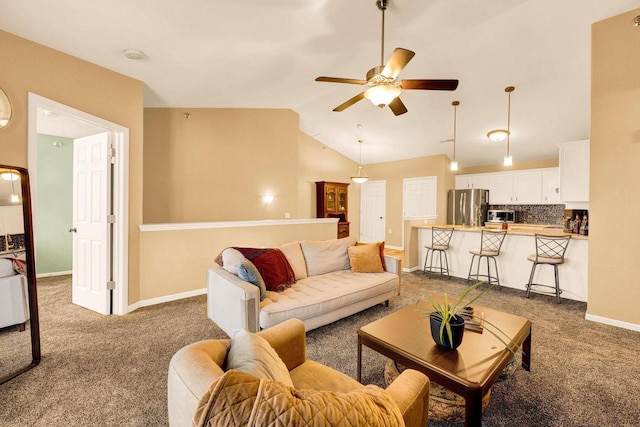 carpeted living room featuring lofted ceiling and ceiling fan