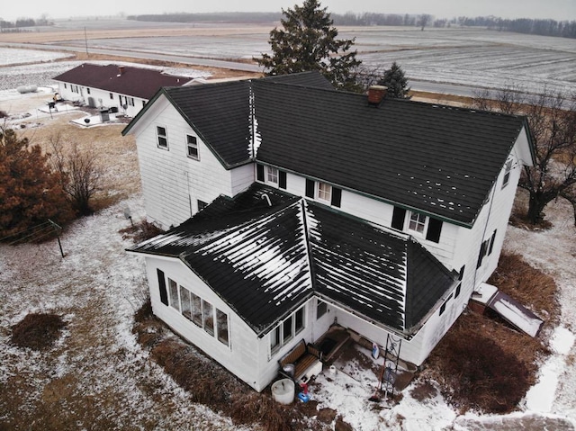 birds eye view of property with a rural view