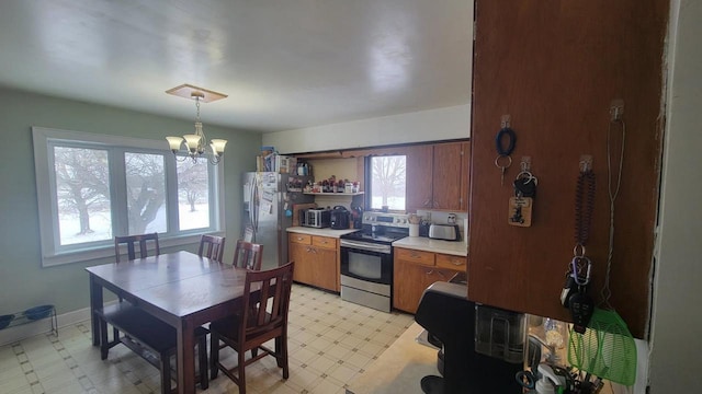3290 Lark Rd, Greenleaf, WI 54126 - kitchen featuring decorative light fixtures, stainless steel appliances, and a chandelier