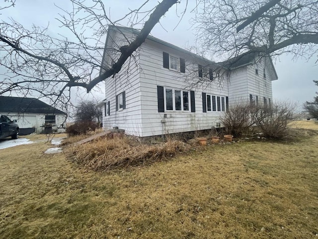 view of home's exterior featuring a yard