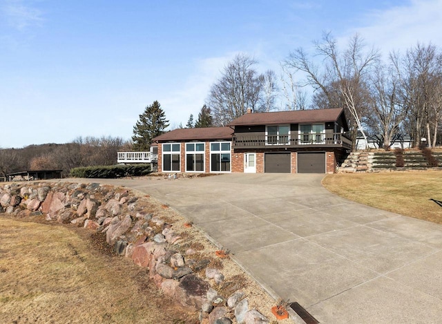 view of front of property with a garage and a front yard