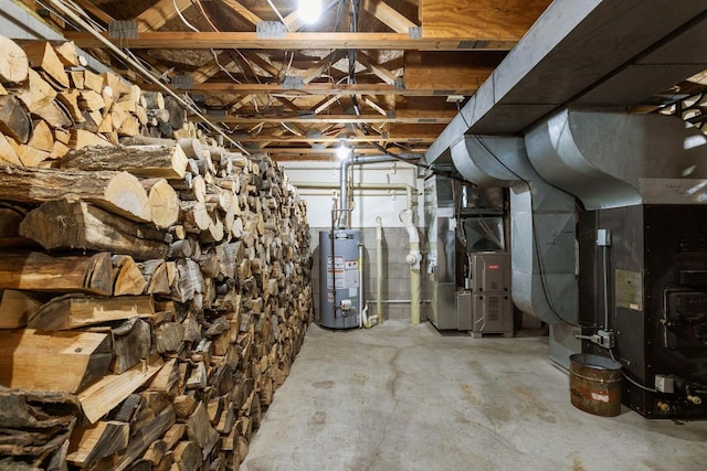 basement featuring heating unit and water heater