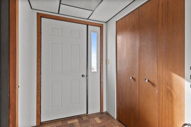 entrance foyer featuring dark parquet floors