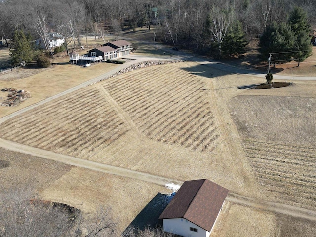 birds eye view of property with a rural view