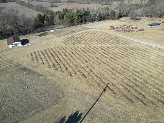 birds eye view of property with a rural view