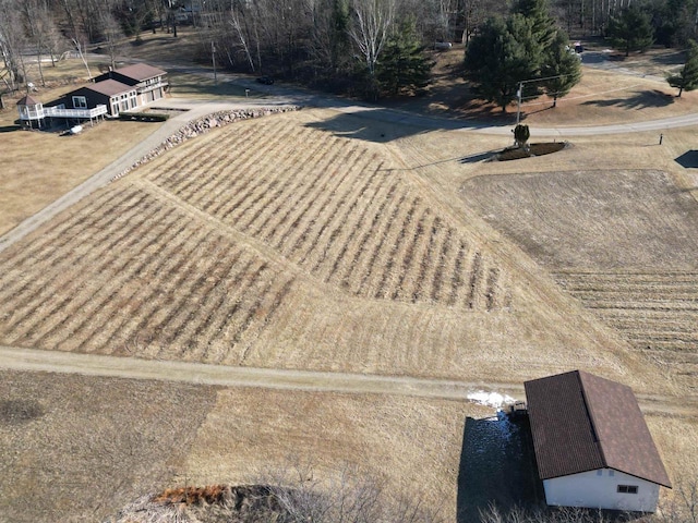 birds eye view of property featuring a rural view