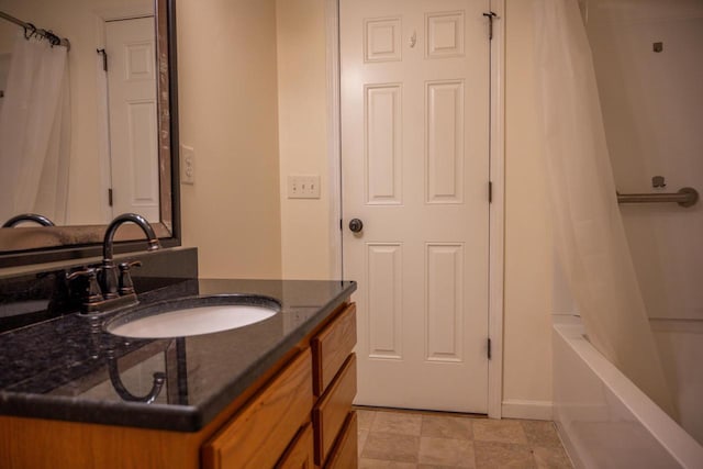 bathroom with shower / tub combo with curtain and vanity