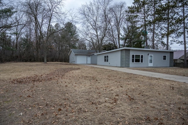 exterior space with an outbuilding and a garage