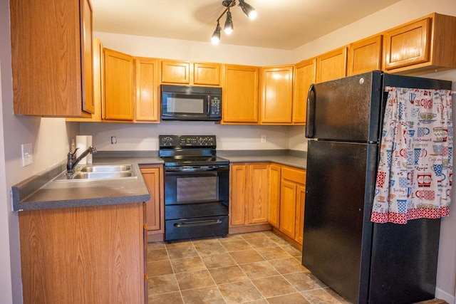 kitchen featuring sink and black appliances