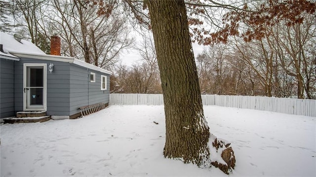 view of yard covered in snow