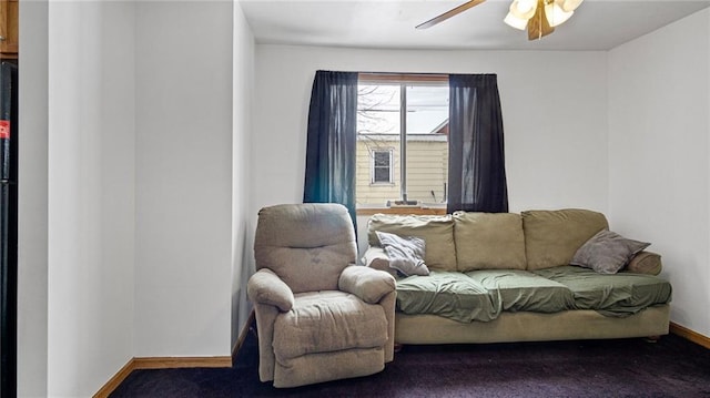 living room with dark carpet and ceiling fan