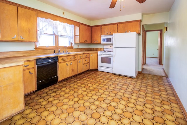 kitchen with sink, white appliances, and ceiling fan