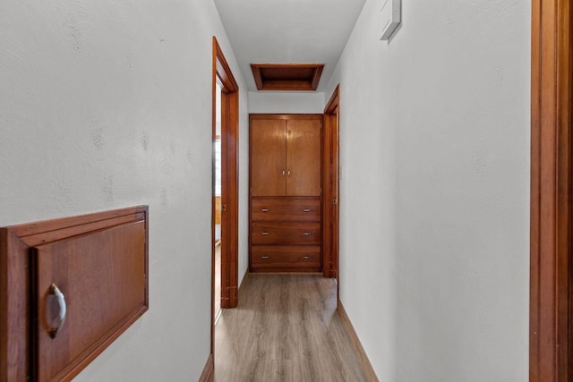 hallway with light wood-type flooring