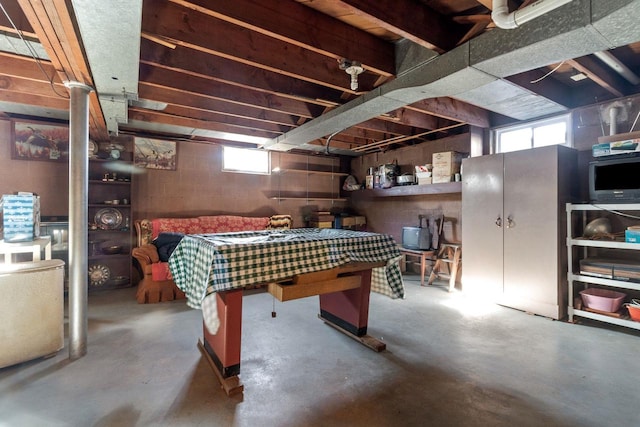 recreation room featuring concrete floors