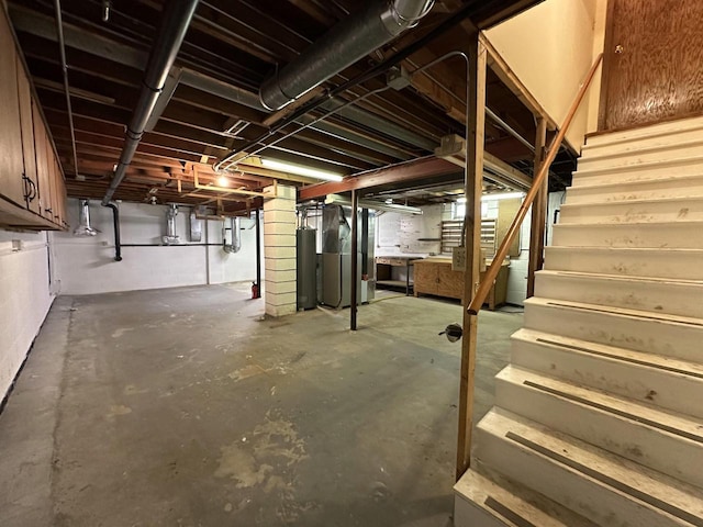 basement featuring heating unit and gas water heater