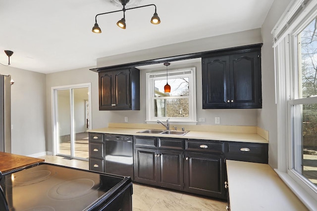 kitchen with pendant lighting, sink, and black appliances