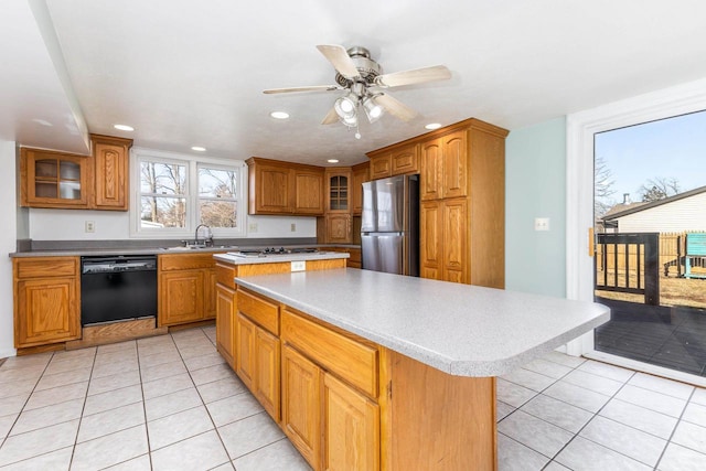 kitchen with light tile patterned flooring, sink, a center island, stainless steel refrigerator, and dishwasher