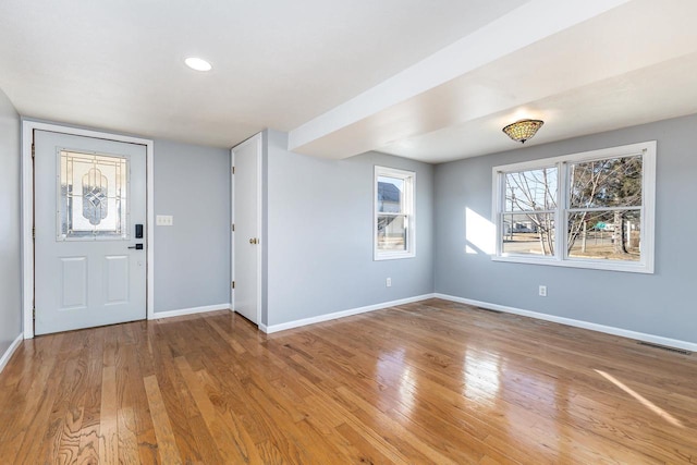 entryway with light hardwood / wood-style floors