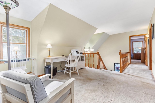 home office featuring an inviting chandelier, light colored carpet, and lofted ceiling