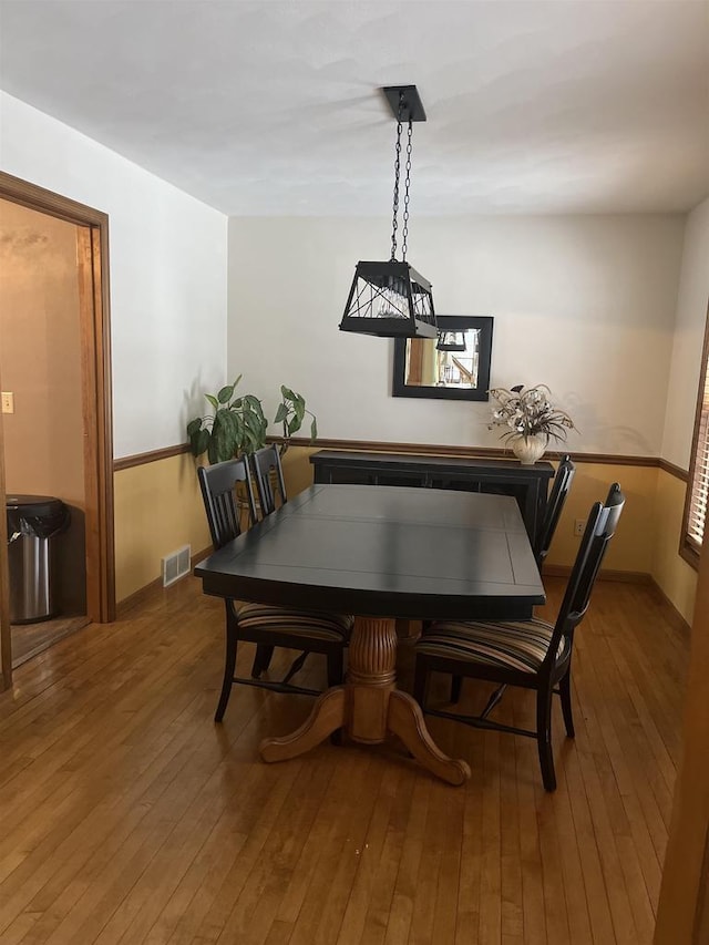 dining room with hardwood / wood-style floors