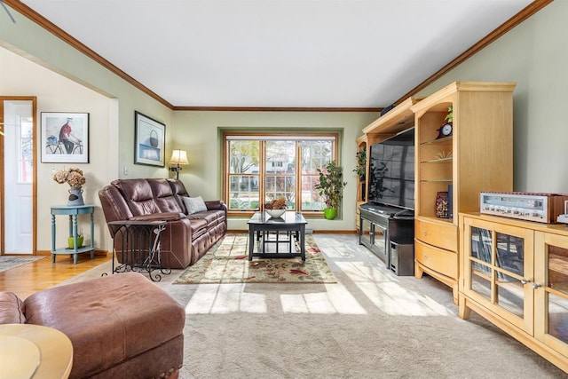 living room with light colored carpet and ornamental molding