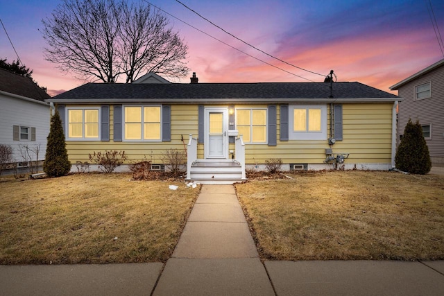 view of front of home with a yard