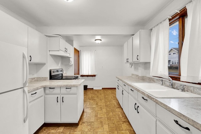 kitchen with white cabinetry, stainless steel range with electric cooktop, sink, and white fridge