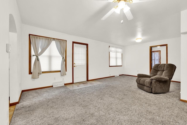 sitting room with light carpet and ceiling fan