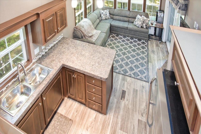 interior space with sink and light wood-type flooring