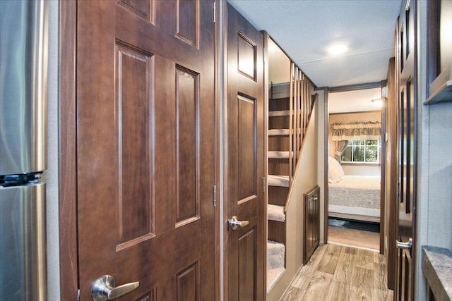 corridor featuring light hardwood / wood-style floors