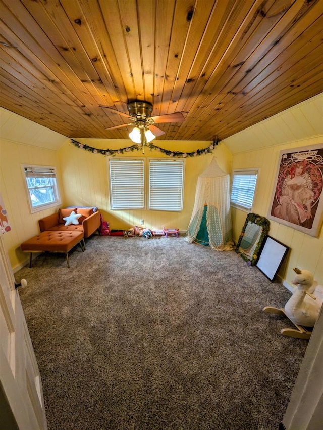 interior space featuring carpet floors, wooden ceiling, and vaulted ceiling