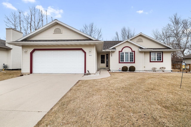 ranch-style house with a garage and a front yard