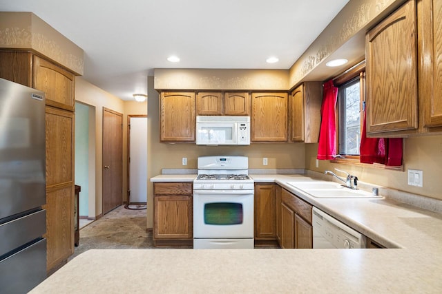 kitchen with sink and white appliances