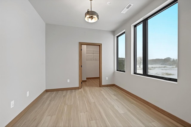 empty room featuring light hardwood / wood-style floors