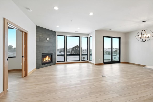 unfurnished living room with plenty of natural light and light wood-type flooring