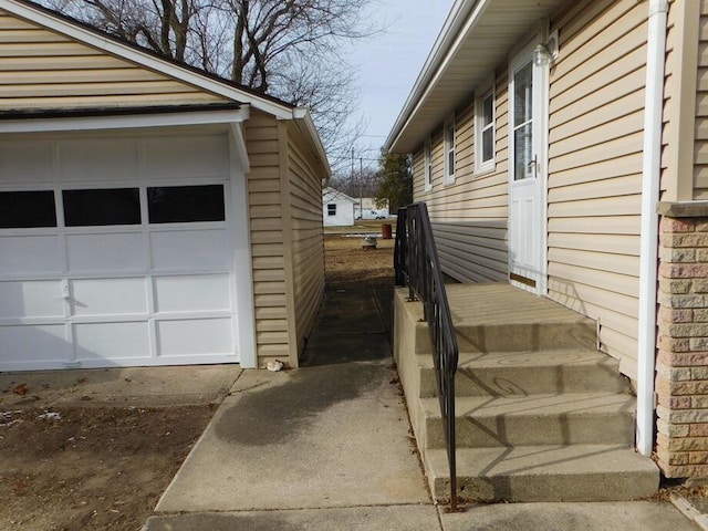 view of side of home featuring a garage