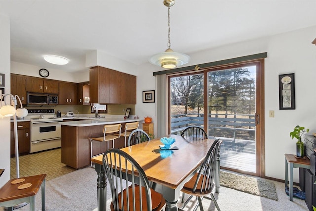 dining space featuring sink