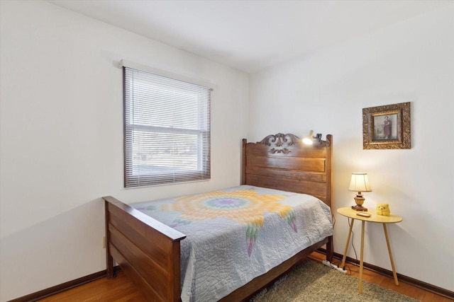 bedroom with wood-type flooring