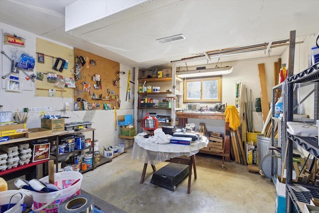 misc room featuring concrete floors and a workshop area