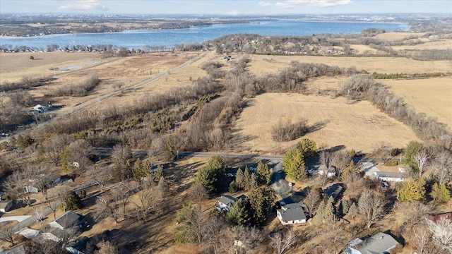 drone / aerial view featuring a water view and a rural view