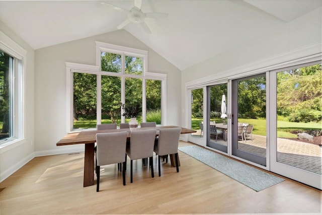 sunroom / solarium with a wealth of natural light, vaulted ceiling, and ceiling fan