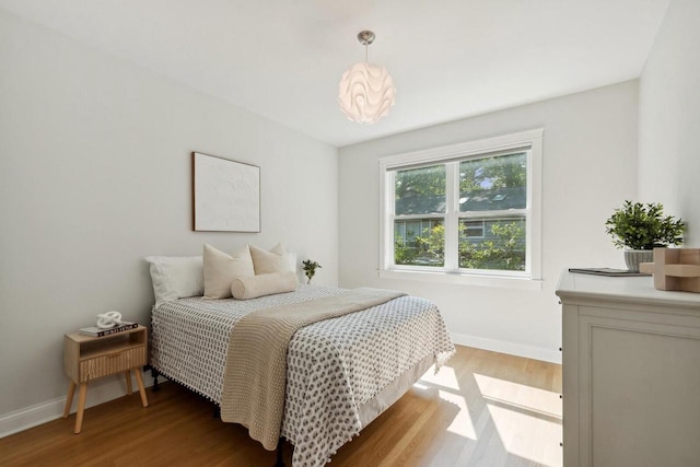 bedroom with light hardwood / wood-style flooring