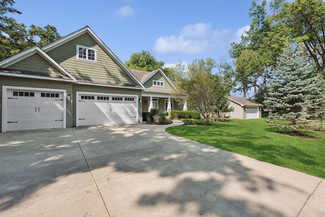 view of front of property with a garage and a front yard