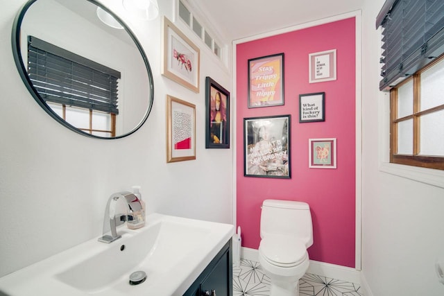 bathroom with vanity and toilet