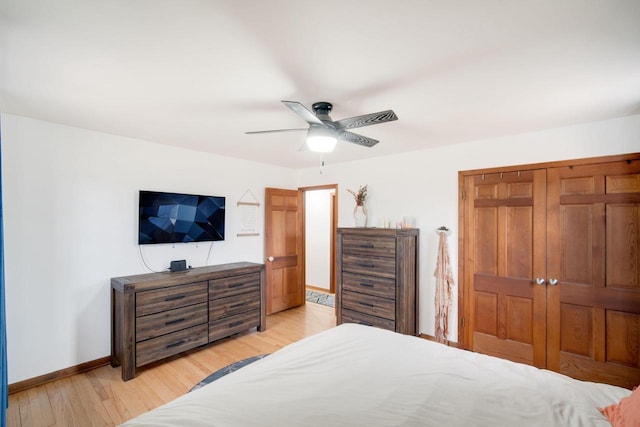 bedroom with ceiling fan and light wood-type flooring