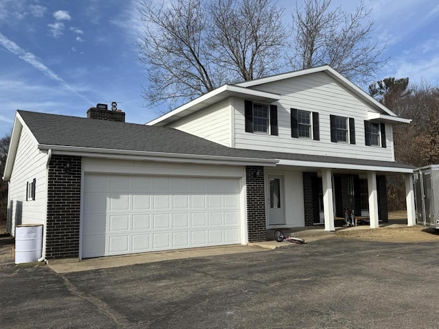 view of front property with a garage and covered porch