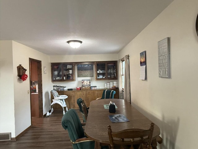 dining room featuring dark wood-type flooring